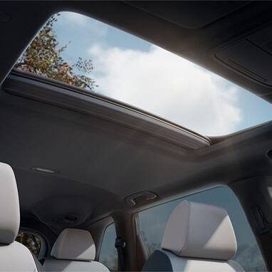 2027 Honda CR-V detail of the panoramic moonroof and interior headliner from the rear seats (Compact Crossover SUV).