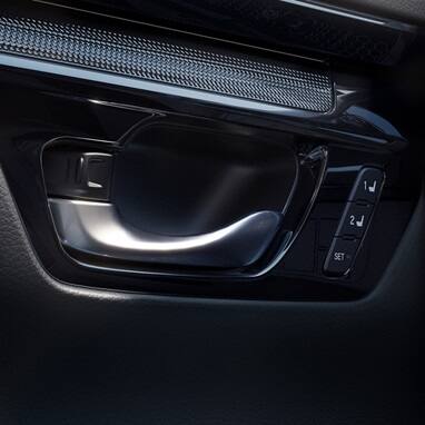 2027 Honda CR-V detail of the door handle and seat memory buttons (Compact Crossover SUV).