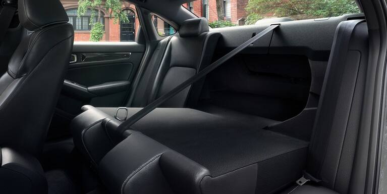 2027 Honda Civic Sedan Sport Touring Hybrid rear seats folded down showing trunk pass-through (Compact Sedan)
